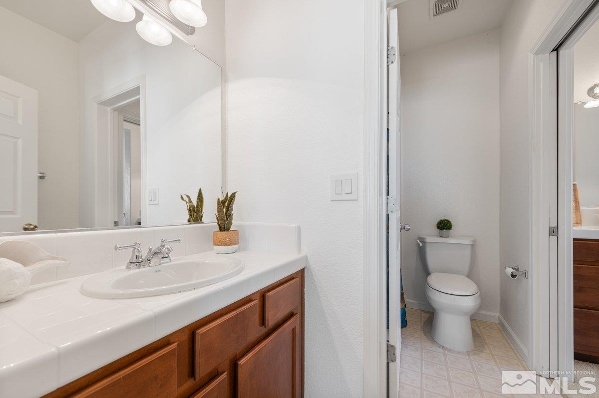 2160 Stanhope Lane Reno, NV 89502 - Photo 26 of 31 a bathroom with a sink and a mirror