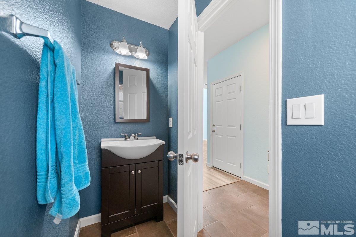 2160 Stanhope Lane Reno, NV 89502 - Photo 6 of 31 a bathroom with a sink and a mirror
