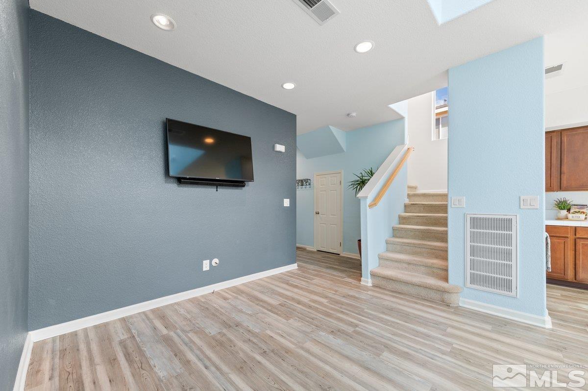 2160 Stanhope Lane Reno, NV 89502 - Photo 7 of 31 a view of a livingroom with wooden floor and stairs