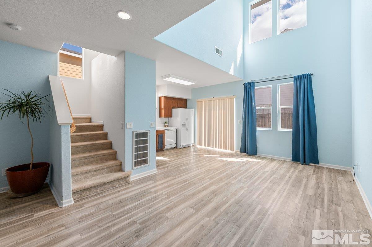 2160 Stanhope Lane Reno, NV 89502 - Photo 8 of 31 a view of a livingroom with wooden floor and stairs