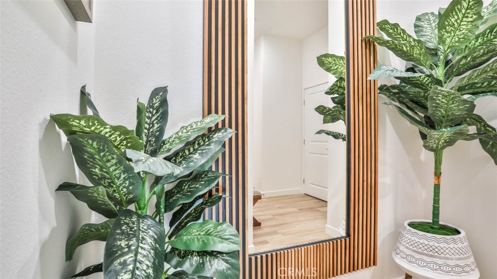 1522 Doheny Way Dana Point, CA 92629 - Photo 11 of 60 a vase of flowers sitting next to a window