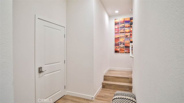 a kitchen with stainless steel appliances granite countertop a sink and refrigerator