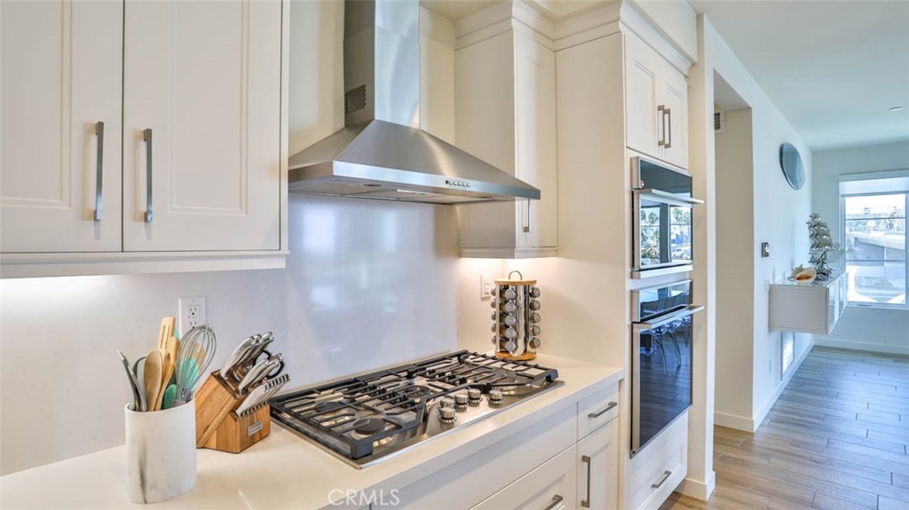 1522 Doheny Way Dana Point, CA 92629 - Photo 20 of 60 a kitchen with stainless steel appliances granite countertop a stove and a refrigerator
