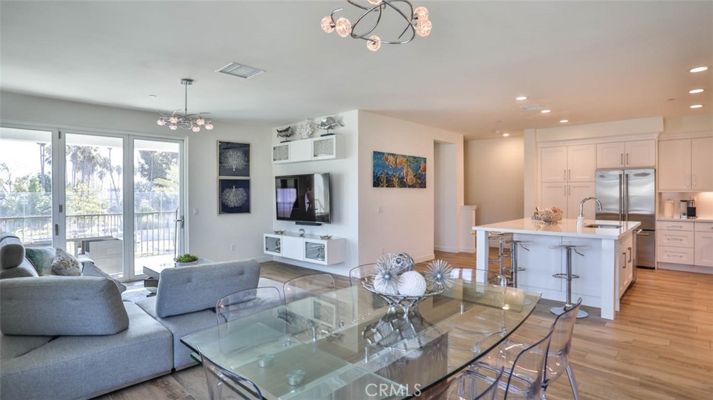 1522 Doheny Way Dana Point, CA 92629 - Photo 23 of 60 a living room with furniture kitchen view and a large window
