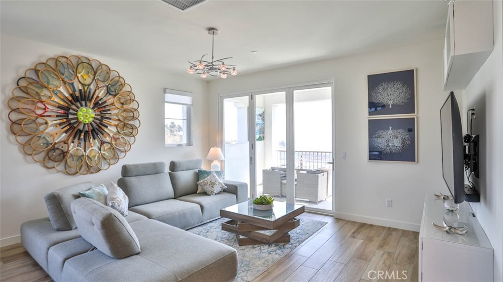 1522 Doheny Way Dana Point, CA 92629 - Photo 24 of 60 a living room with furniture and a flat screen tv