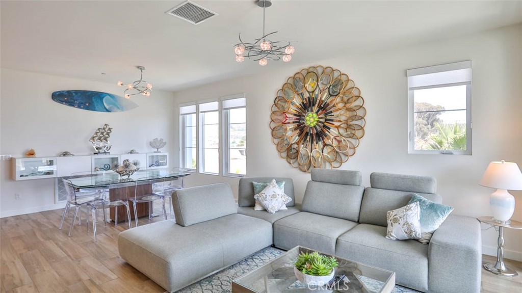 1522 Doheny Way Dana Point, CA 92629 - Photo 25 of 60 a living room with furniture and a large window