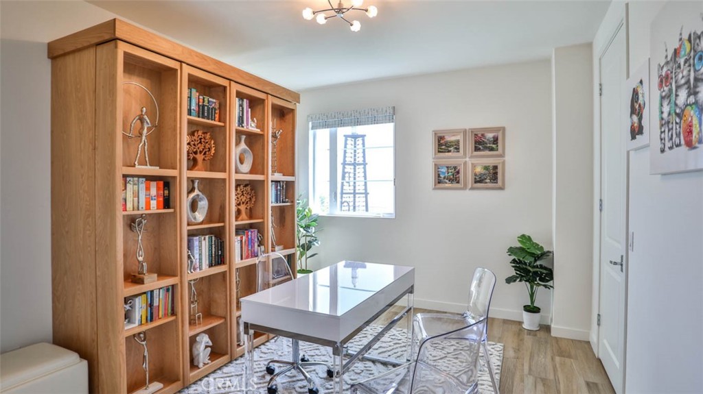 1522 Doheny Way Dana Point, CA 92629 - Photo 27 of 60 a view of a workspace with furniture and a book shelf