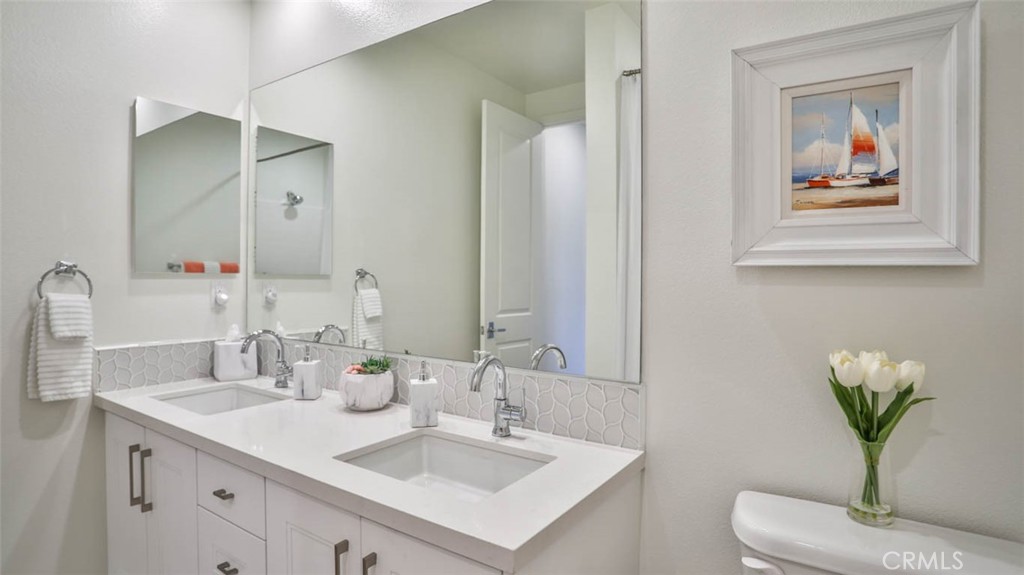 1522 Doheny Way Dana Point, CA 92629 - Photo 42 of 60 a bathroom with a sink vanity and a mirror