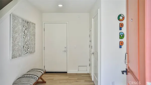 a view of entryway with wooden floor