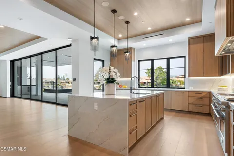 a spacious bedroom with a large bed and a large window