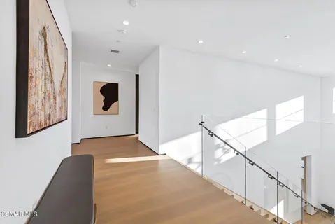 a spacious bathroom with a double vanity sink toilet mirror and bathtub