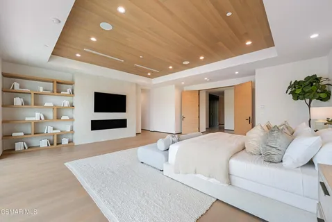 a kitchen with a sink cabinets and a window