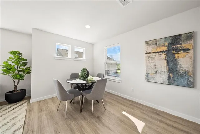 a workspace with furniture and a potted plant