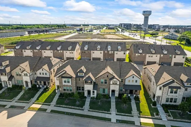 an aerial view of residential building with swimming pool and ocean view