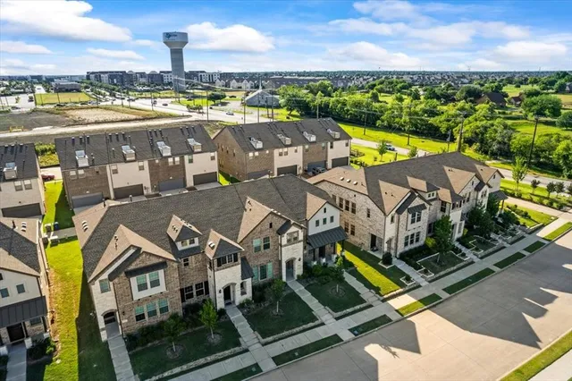 an aerial view of a house with a big yard