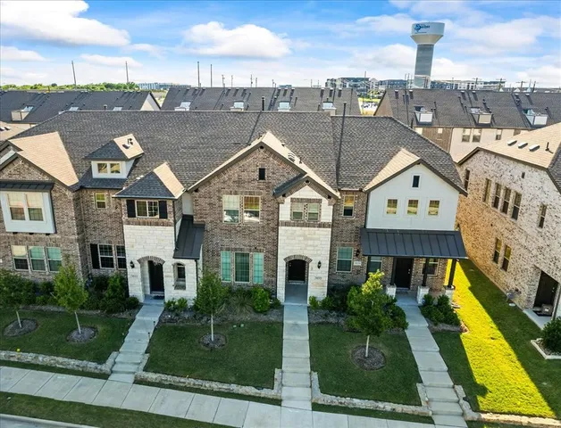 a aerial view of a house with a yard