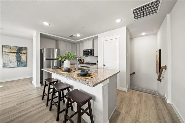 a kitchen with a table and chairs in it