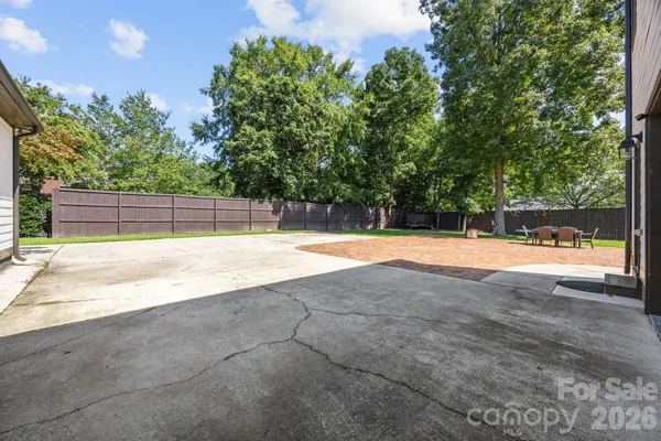 a view of a swimming pool and a yard