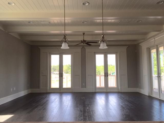 167 Clipper Street Inlet Beach, FL 32461 - Photo 11 of 43 a view of a room with wooden floors and a chandelier