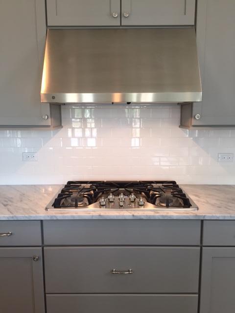 167 Clipper Street Inlet Beach, FL 32461 - Photo 13 of 43 a white stove top oven sitting inside of a kitchen