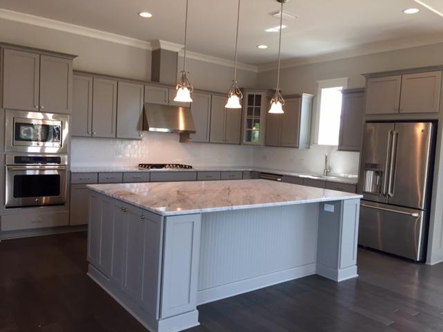 167 Clipper Street Inlet Beach, FL 32461 - Photo 17 of 43 a kitchen with kitchen island a counter space a sink appliances and cabinets