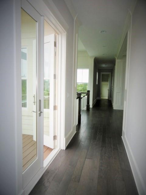 167 Clipper Street Inlet Beach, FL 32461 - Photo 23 of 43 a view of a hallway with wooden floor and a living room