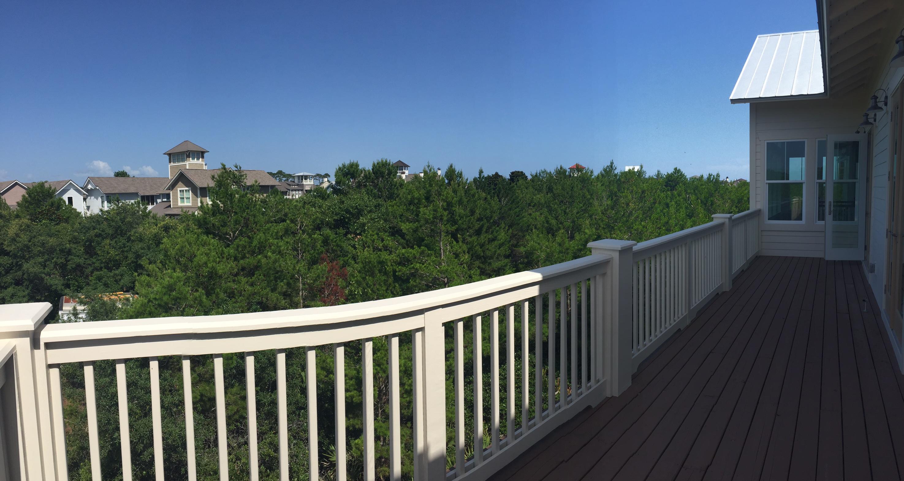 167 Clipper Street Inlet Beach, FL 32461 - Photo 5 of 43 a balcony with wooden floor in front of house