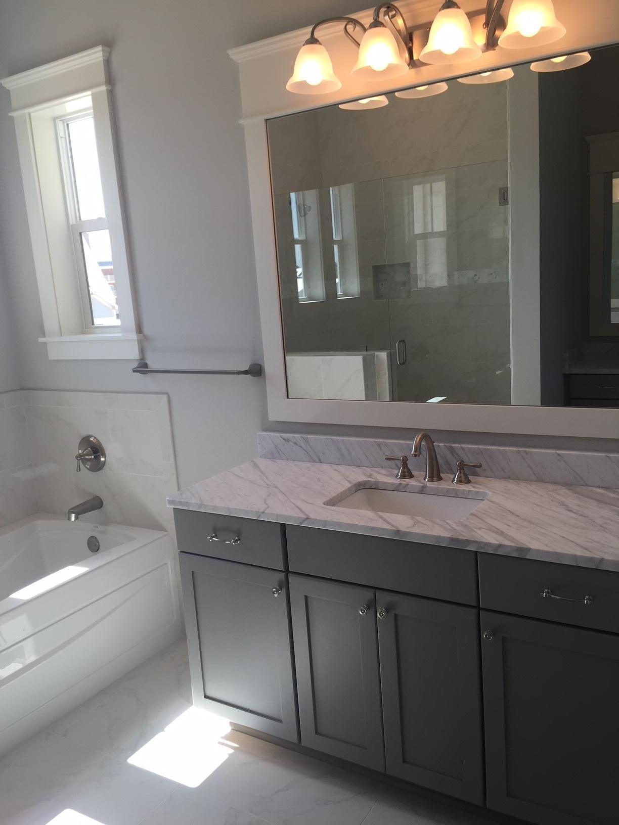 167 Clipper Street Inlet Beach, FL 32461 - Photo 42 of 43 a bathroom with a granite countertop sink a mirror and a bathtub
