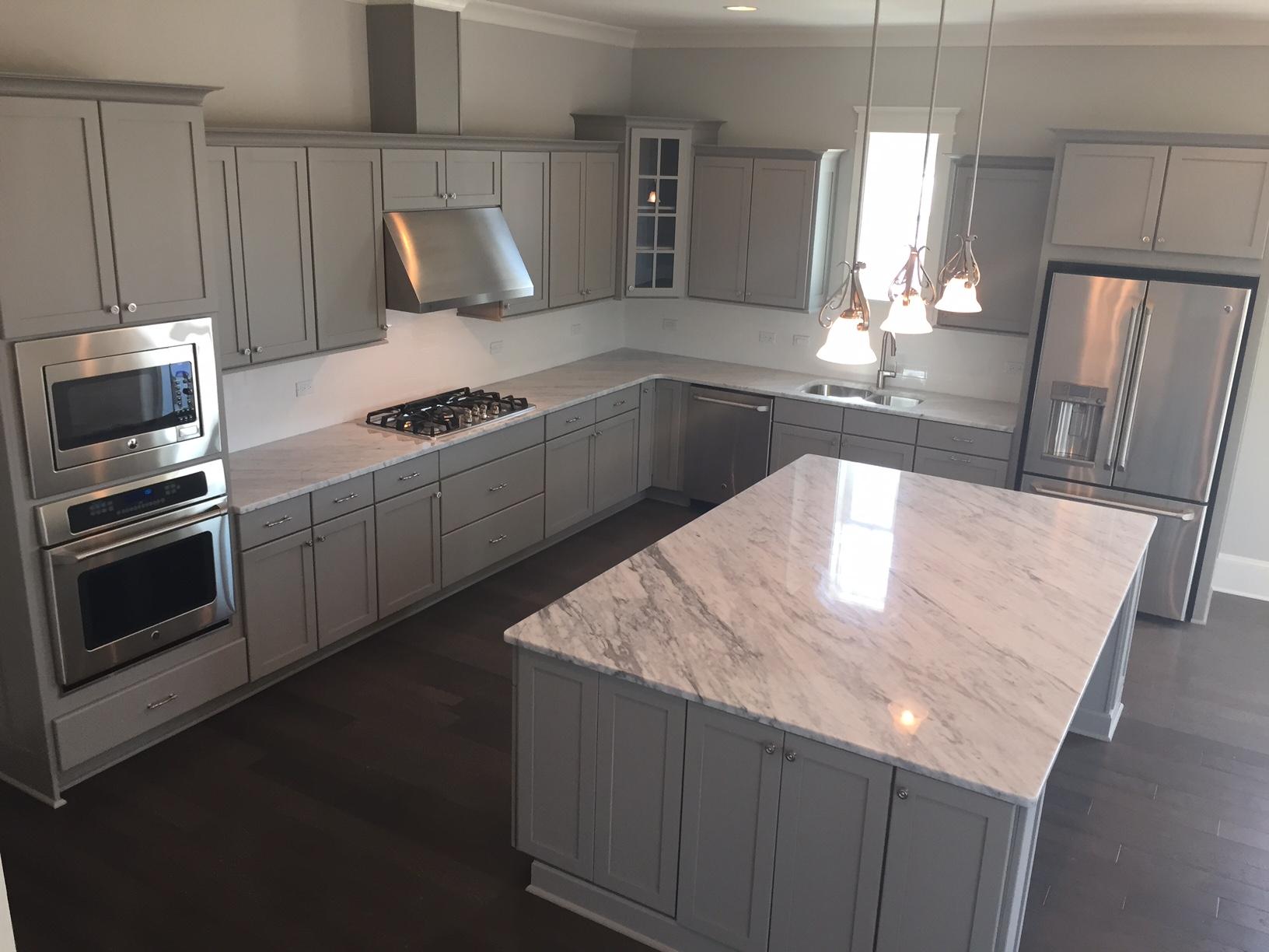 167 Clipper Street Inlet Beach, FL 32461 - Photo 7 of 43 a kitchen with stainless steel appliances granite countertop a stove a sink and a refrigerator