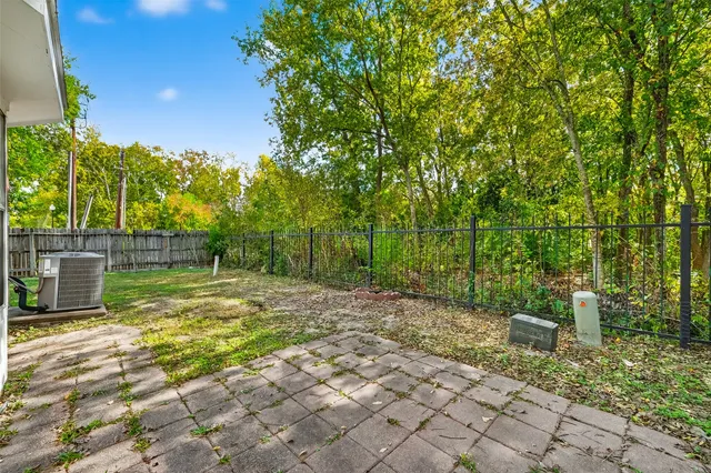 a view of a yard with trees