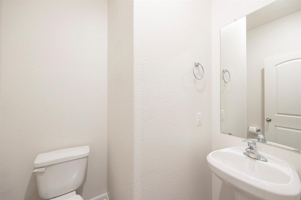 13608 Mineral Road Ponder, TX 76259 - Photo 11 of 36 Half bath featuring toilet and a sink