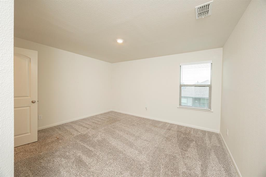 13608 Mineral Road Ponder, TX 76259 - Photo 23 of 36 Unfurnished room featuring carpet flooring, recessed lighting, and a textured ceiling