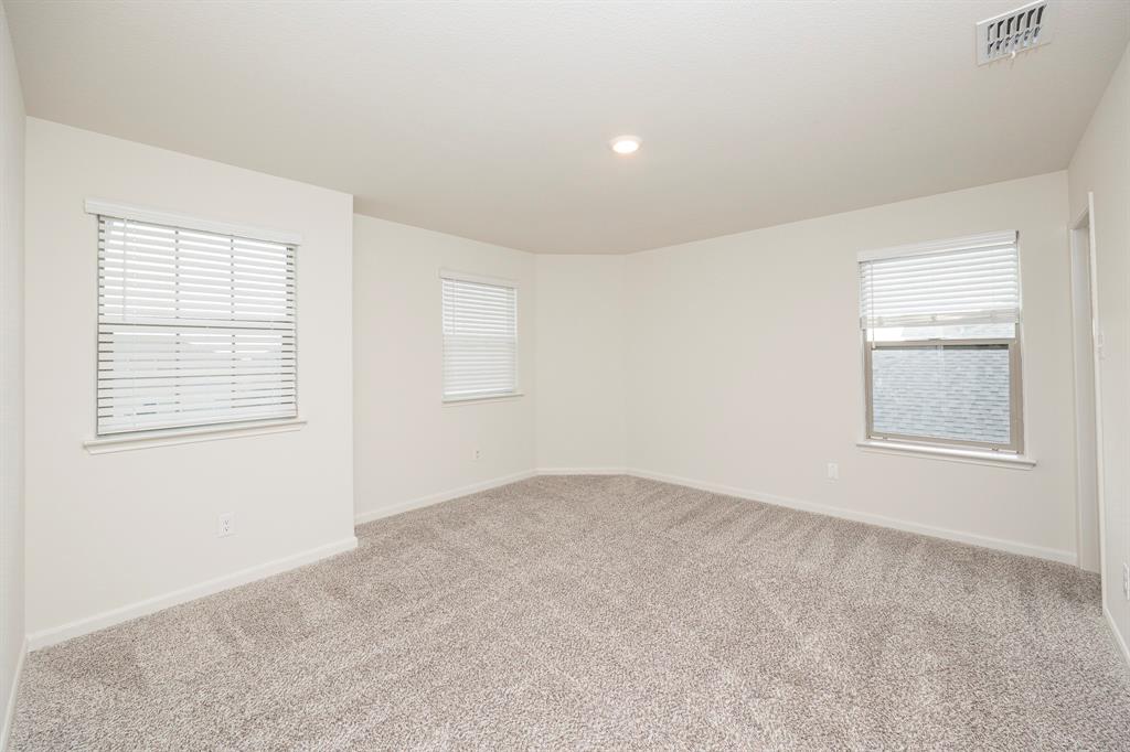 13608 Mineral Road Ponder, TX 76259 - Photo 27 of 36 Empty room featuring carpet floors and recessed lighting