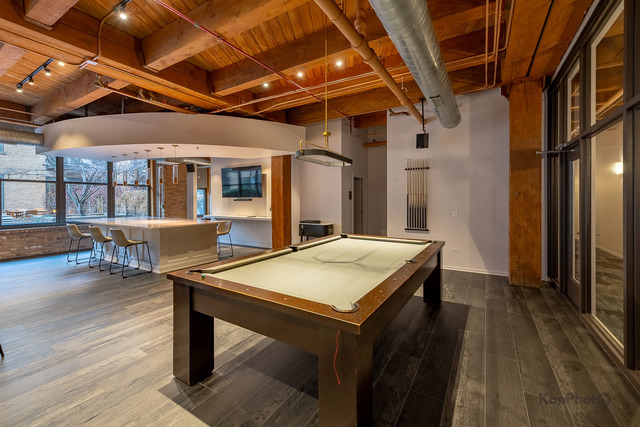 1040 West Adams Street, Unit 350 Chicago, IL 60607 - Photo 22 of 22 a view of a porch with furniture and wooden floor