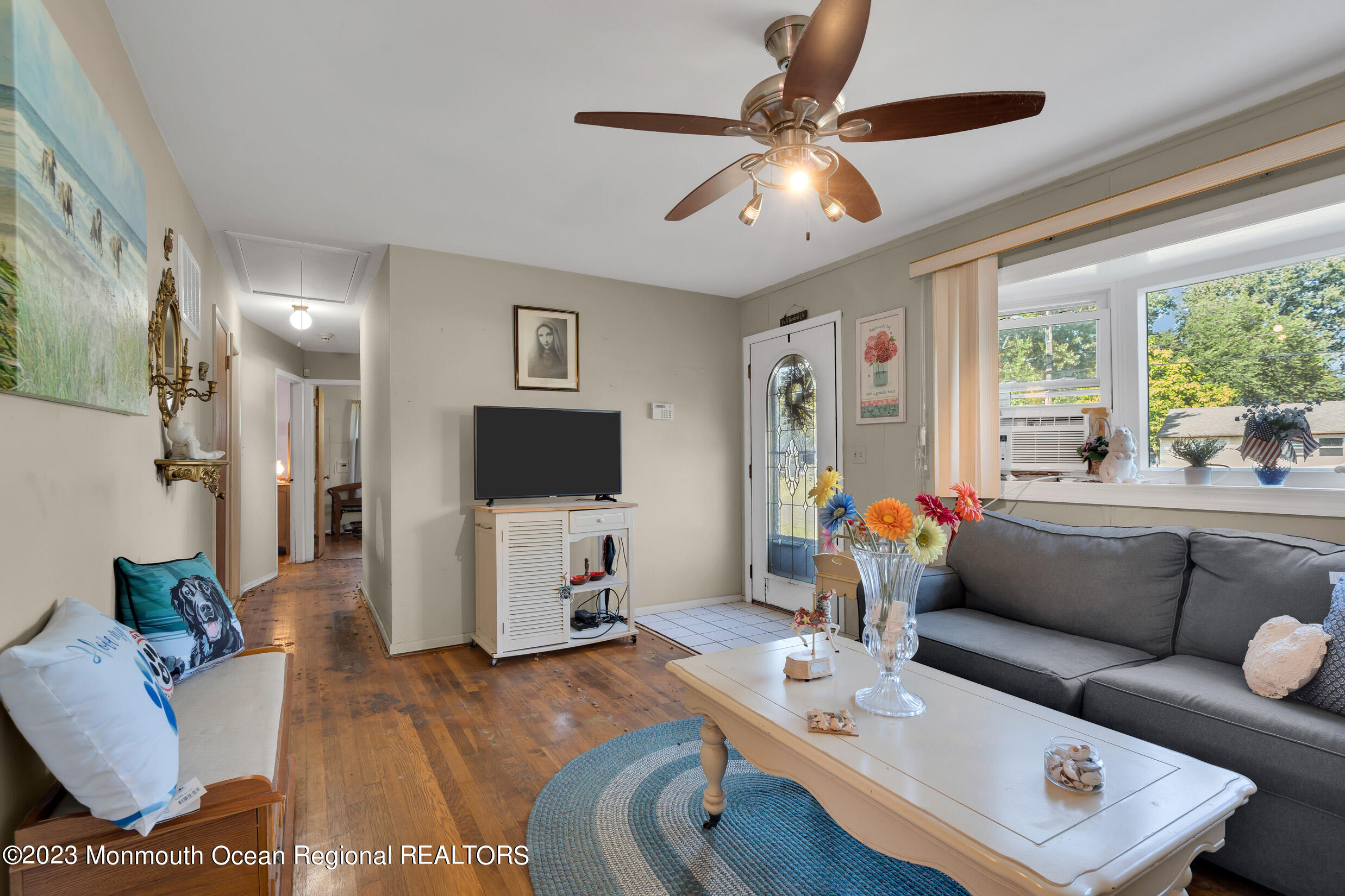 325 Stearman Road Brick, NJ 08723 - Photo 16 of 35 a living room with furniture and a flat screen tv