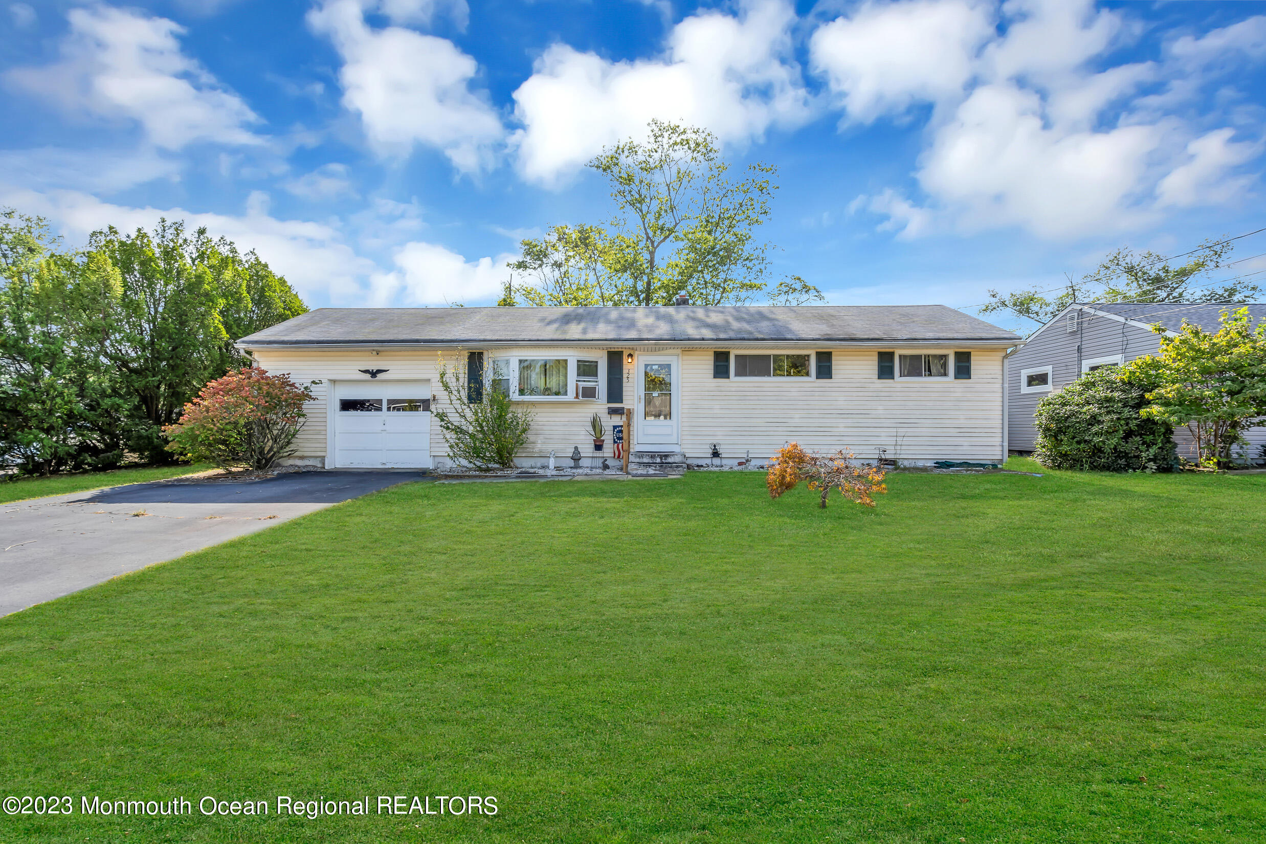 325 Stearman Road Brick, NJ 08723 - Photo 2 of 35 a front view of house with yard and green space