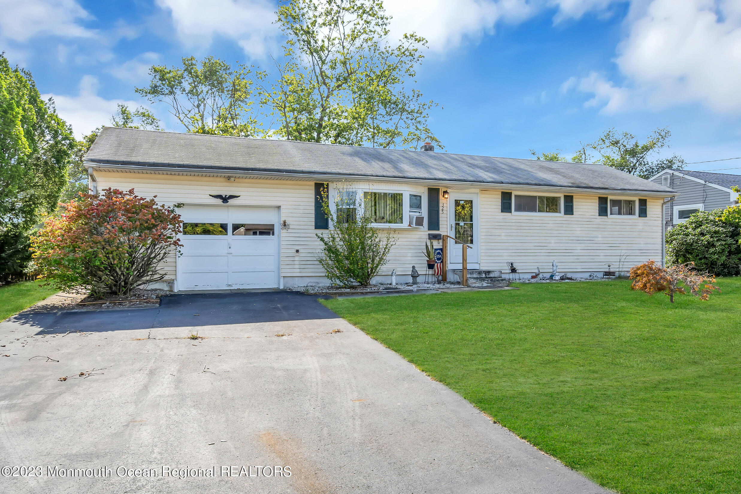 325 Stearman Road Brick, NJ 08723 - Photo 7 of 35 front view of house with a yard