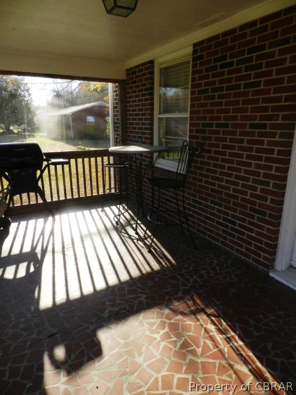 7259 Independence Road Gloucester, VA 23061 - Photo 15 of 18 Screen porch on back of home.