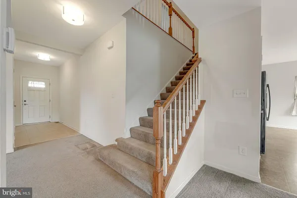 a view of a hallway with staircase