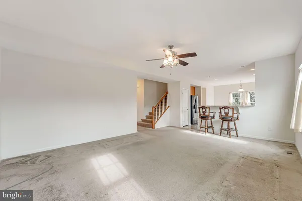 a view of an empty room with a fireplace