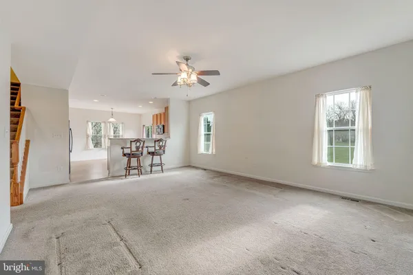 a view of livingroom with furniture and chandelier fan