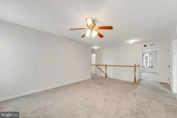 a view of a livingroom with a ceiling fan