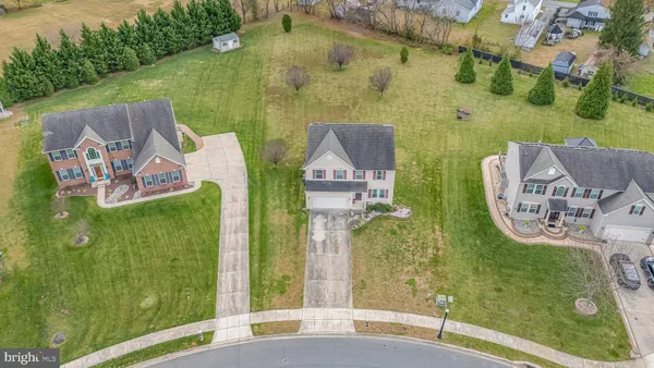 aerial view of a house with swimming pool garden and patio