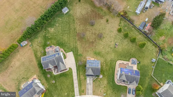 an aerial view of a house with outdoor space and a sink