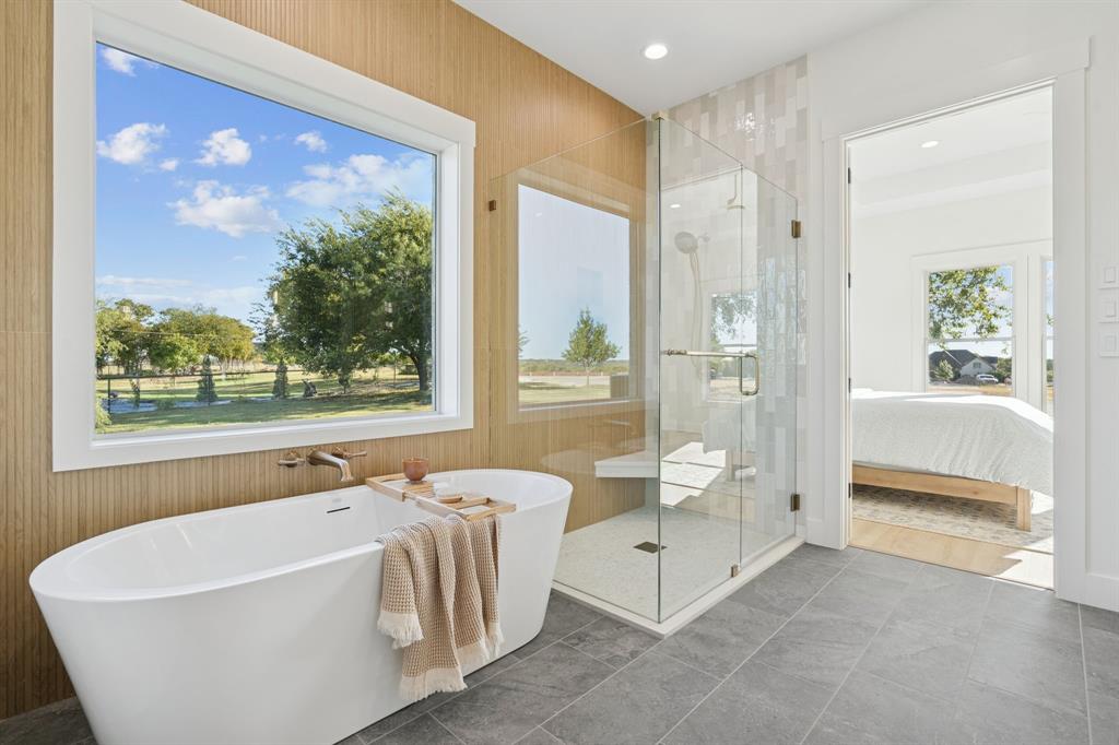8008 Ben Day Murrin Road Fort Worth, TX 76126 - Photo 19 of 40 a white bath tub sitting next to a toilet
