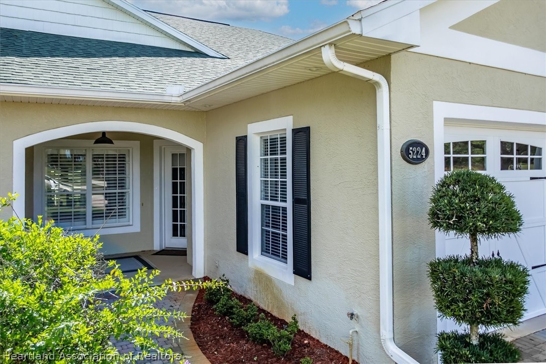 5224 Haw Branch Road Sebring, FL 33875 - Photo 39 of 40 a front view of a house with garden