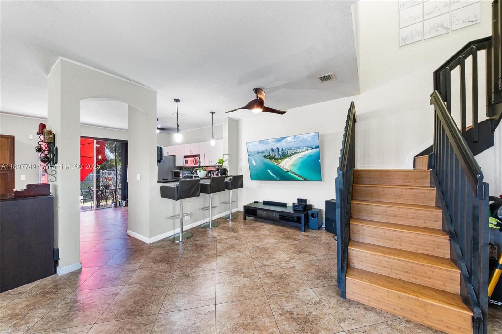 3869 Northwest 92nd Avenue Sunrise, FL 33351 - Photo 11 of 40 a living room with furniture and a flat screen tv