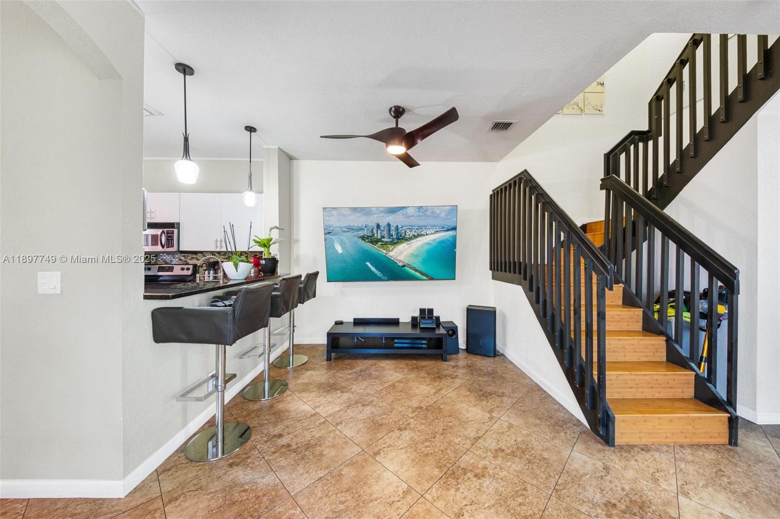 3869 Northwest 92nd Avenue Sunrise, FL 33351 - Photo 12 of 40 a living room with furniture and a flat screen tv