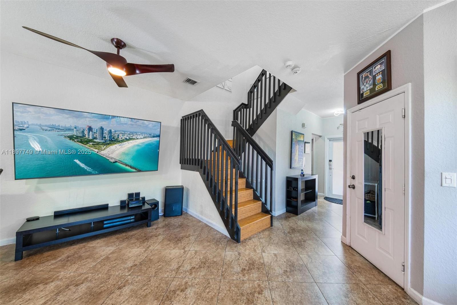 3869 Northwest 92nd Avenue Sunrise, FL 33351 - Photo 13 of 40 a view of a livingroom with furniture and a flat screen tv
