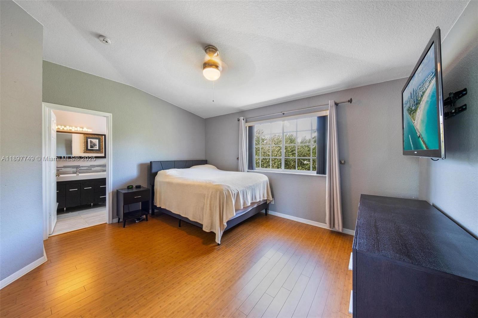 3869 Northwest 92nd Avenue Sunrise, FL 33351 - Photo 19 of 40 a bedroom with a bed and a couch